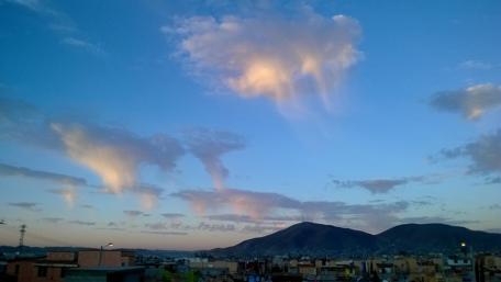 Sky Whirls Over Urban Landscape wallpaper