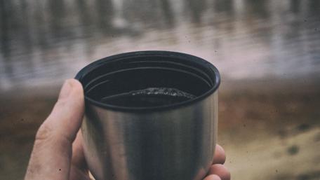 Sip of Serenity by the Riverbank wallpaper