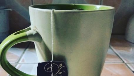 Warm Moments with Tea in a Cozy Mug wallpaper