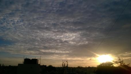Serene Sunset Over a Cloudy Sky wallpaper