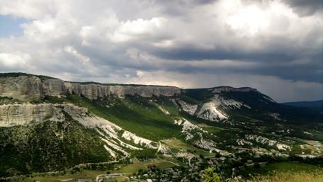 Majestic Mountain Landscape Under Dramatic Skies wallpaper