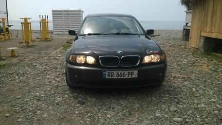 Sleek BMW on a Coastal Road wallpaper