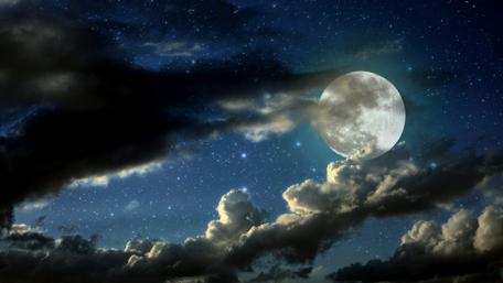 Majestic Full Moon Over Cloudy Night Sky wallpaper