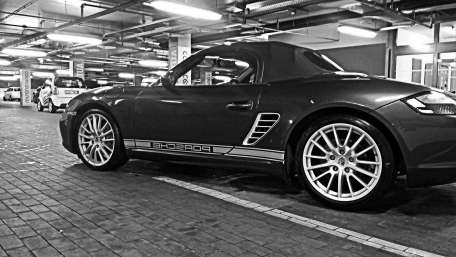 Sleek Monochrome Porsche in Parking Garage wallpaper