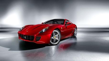 Sleek Red Sports Car in a Modern Space wallpaper