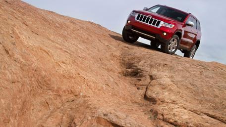 Adventurous SUV on Rugged Terrain wallpaper