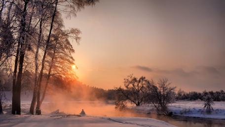 Serene Winter Sunset Over a Misty River wallpaper