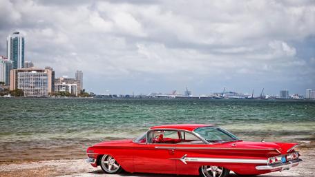Classic Red Vintage Car by the Shoreline wallpaper