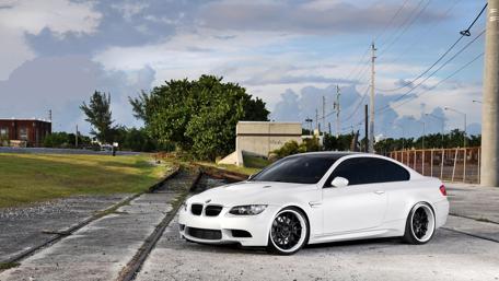 Sleek White BMW M3 Coupe in Urban Setting wallpaper