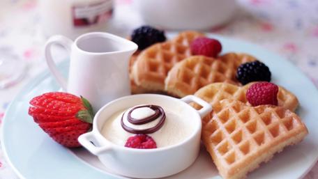 Delicious Waffles with Fresh Berries and Creamy Dip wallpaper