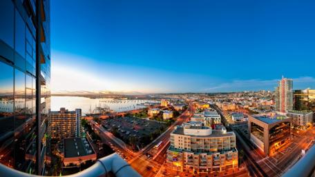 Vibrant Cityscape Under a Clear Blue Sky wallpaper