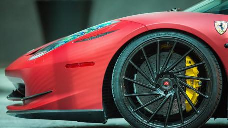 Sleek Red Ferrari Close-Up Showcase wallpaper