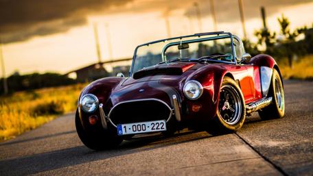 Vintage Car in Scenic Countryside wallpaper