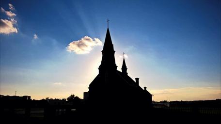 Silhouette of a Church Against a Summer Sunset wallpaper