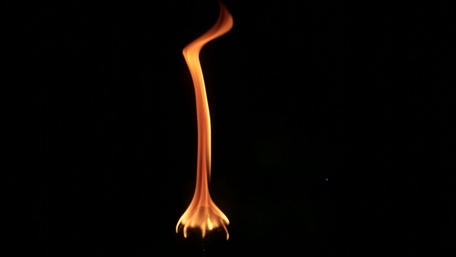 Flickering Fire in Darkness wallpaper
