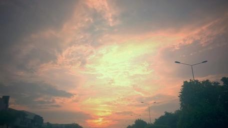 Fiery Sunset Over Calm Clouds wallpaper