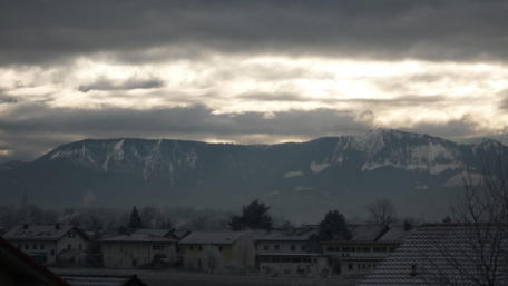 Mysterious Winter Landscape Under Cloudy Skies wallpaper