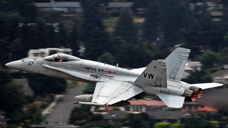 Fighter Jet in Action Above the City wallpaper