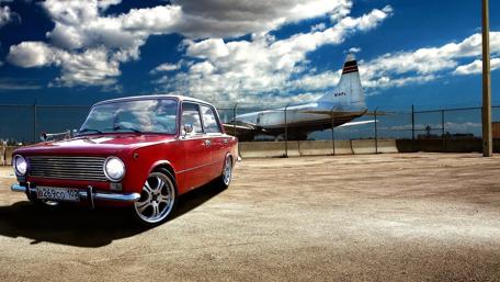 Vintage Red Car by the Airport wallpaper