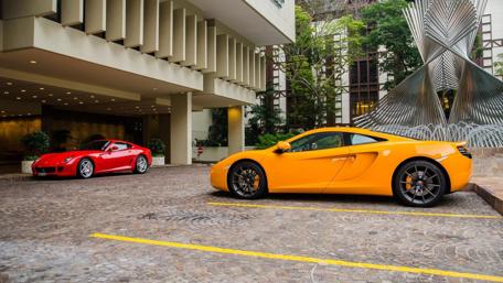 Vibrant Luxury Cars in a Sophisticated Setting wallpaper