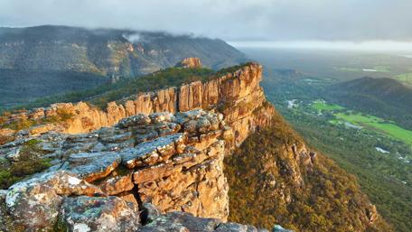 Majestic Mountain Peak at Dawn's Light wallpaper