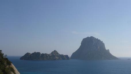 Serene Island View Under Clear Blue Sky wallpaper