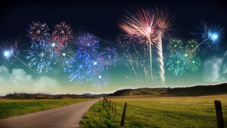 Vibrant Fireworks Lighting Up the Night Sky wallpaper
