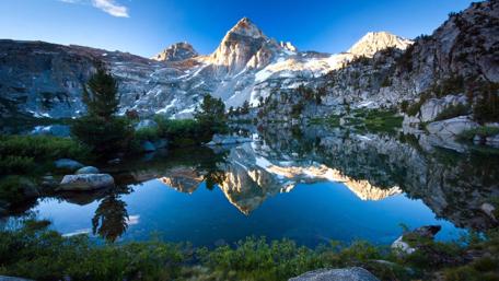 Mountain Peaks Reflect on Serene Lake Surface wallpaper