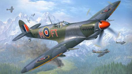 Majestic Spitfire Soaring Over Mountainous Terrain wallpaper