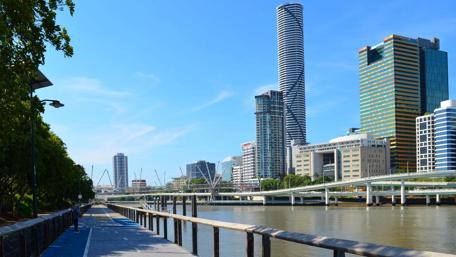 Vibrant Cityscape Under a Clear Blue Sky wallpaper