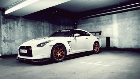 Sleek Performance in a Modern Garage wallpaper