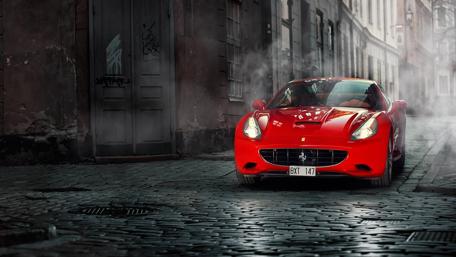 Red Ferrari on a Misty Street Scene wallpaper