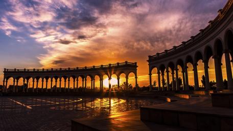 Urban Sunset Serenity Over Historic Architecture wallpaper