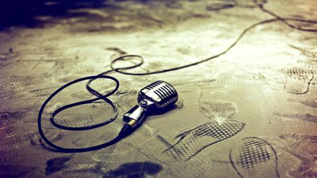 Vintage Microphone on a Dusty Stage wallpaper