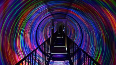 Vibrant Spiral Journey Through Light and Color wallpaper