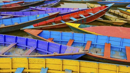 Colorful Boats on Water Surface Inspired by Life's Vibrancy wallpaper