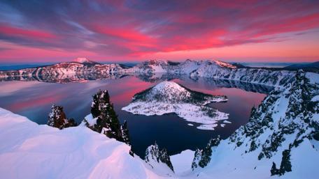 Majestic Winter Sunset Over a Serene Lake wallpaper