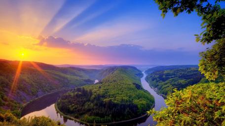Breathtaking Sunrise Over Serene Valley River Landscape wallpaper