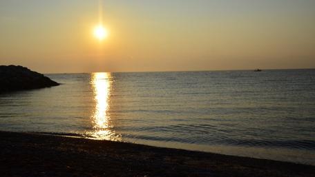 Breathtaking Sunrise Over a Greek Seaside City wallpaper