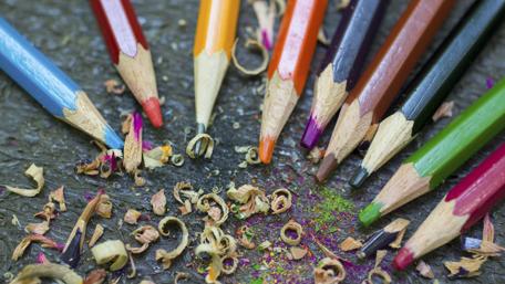 Colorful Pencils and Shavings Create a Vibrant Scene wallpaper