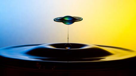 Cosmic Water Drop in Motion wallpaper