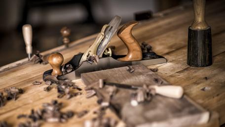 Craftsmanship Tools on a Wooden Workbench wallpaper