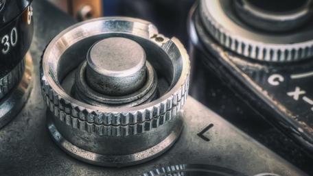 Intricate Mechanism of Vintage Camera Gear wallpaper