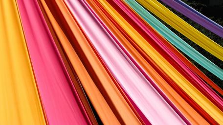 Vibrant Rippled Fabrics for Creative Inspiration wallpaper