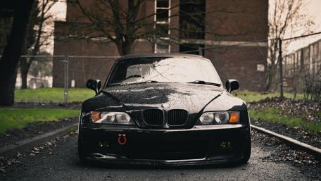Sleek Black BMW Z3 Under Moody Skies wallpaper