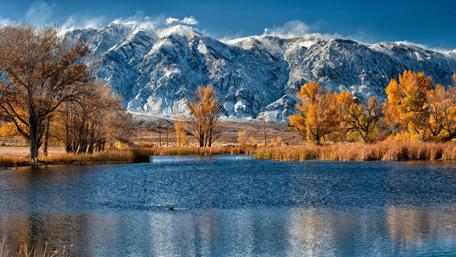 Majestic Mountains Reflected in Tranquil Waters wallpaper