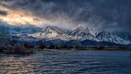 Majestic Mountains Under Moody Skies wallpaper
