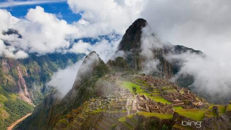 Majestic Machu Picchu Enveloped in Misty Clouds wallpaper