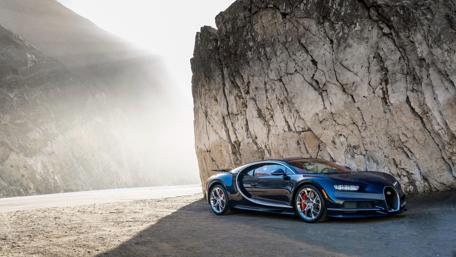 Sleek Sports Car Against Majestic Landscape wallpaper