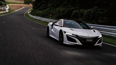 Sleek White NSX on winding road under twilight sky wallpaper